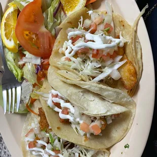Fish tacos. Be warned it only comes with the salad (no beans or rice as pictured in their menu).