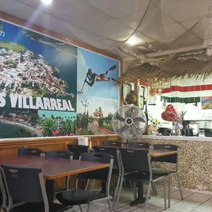 a restaurant with tables and chairs