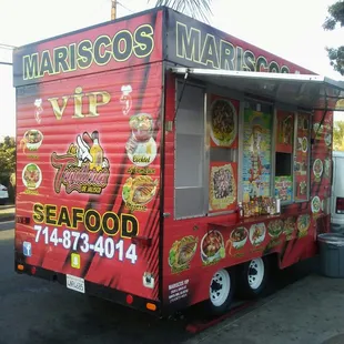 a food truck parked on the side of the road