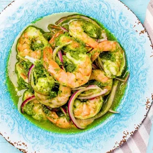 a bowl of shrimp and broccoli
