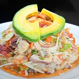 an avocado on top of a salad