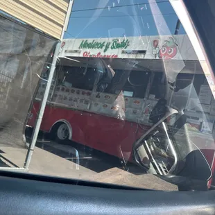 the reflection of a bus in the window
