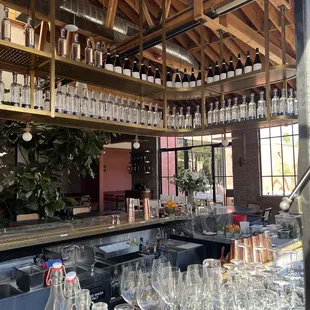 a bar filled with empty wine glasses