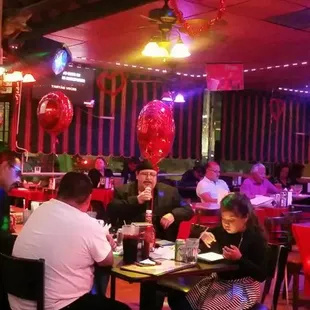 people sitting at tables in a restaurant