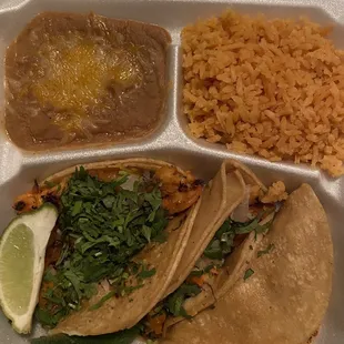 Shrimp tacos, refried beans, &amp; rice.