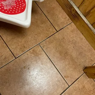 a toilet with a red lid