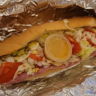 SuperSub ham, salami, pepperoni, cheese,lettuce,tomato,onion and Italian dressing $8.25