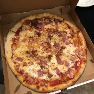 Hawaiian pizza with bacon and ham