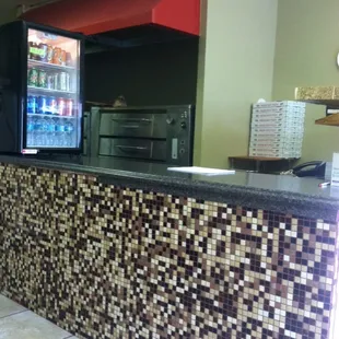 The counter . Small inside seating but very comfortable and cozy. Very friendly