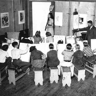 Children on scholarship take a drawing class in 1948.
