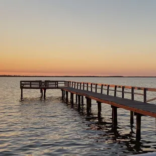 a pier at sunset