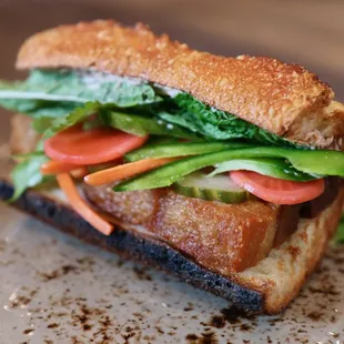 Bahn Mi on lunch menu.  Crispy pork belly, patê, seasonal house pickles,  jalapeno, baguette.