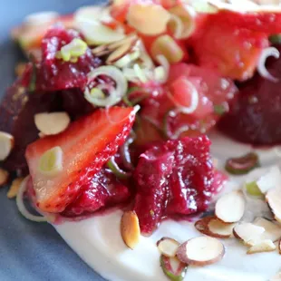 Beets! Local cured strawberries with spring onion, toasted almond, and honey-garlic crema.