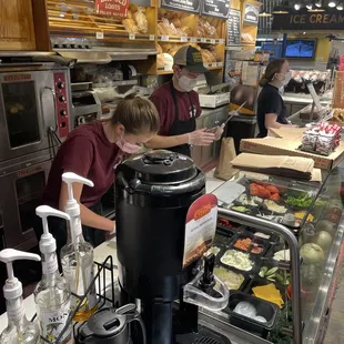 customers preparing food at counter