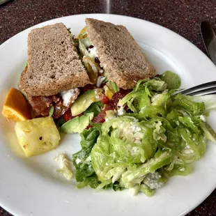 Bacon, avocado, lettuce, tomato sandwich with Brussel sprout slaw