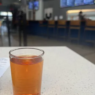 a glass of beer on a table