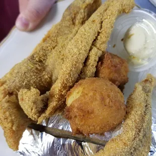 a plate of fried fish and fries
