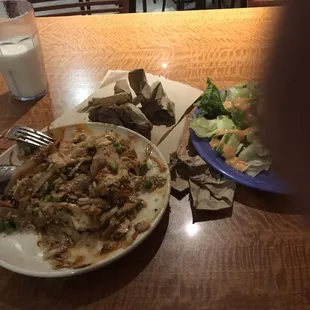 a plate of food and a glass of milk