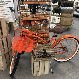 a bicycle with a basket of bread