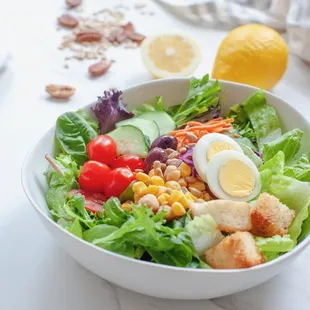 a bowl of salad on a table