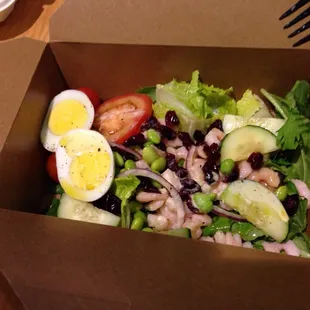 a salad in a paper box