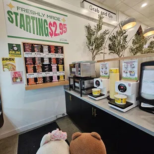 Grab a Ramen package from the wall, add water, and warm it up right here, next to the microwaves