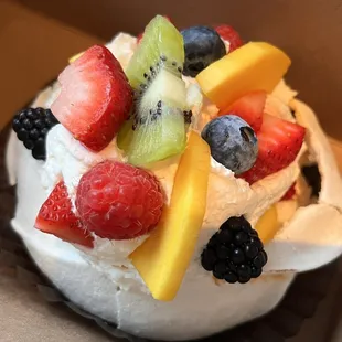 a cupcake with fruit on top