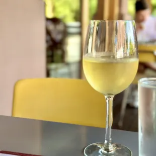 a glass of wine on a table