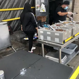 two people preparing food