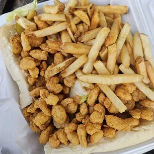 Shrimp poboy with a side of fries