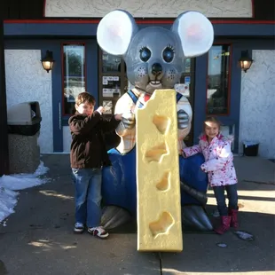 two children and a mouse statue