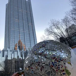 a large metal ball with a mosaic design on it