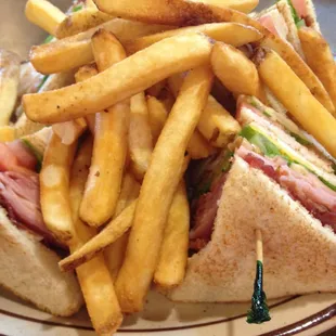 Club sandwich with fries