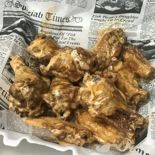 Dozen traditional bone-in spicy garlic Wings*