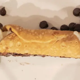 a chocolate chip pie with whipped cream and chocolate chips