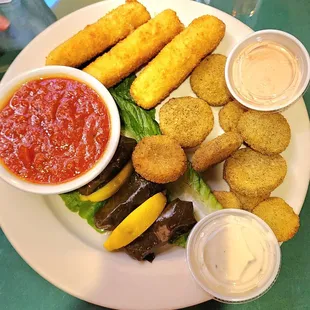 a plate of food and dipping sauce