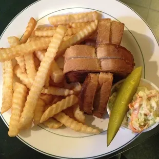 All American grilled cheese on sourdough bread with cole slaw and a pickle