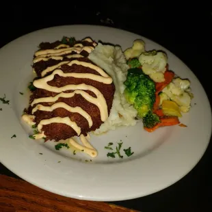Crab Cake dinner with mashed potatoes and grilled vegetables. A delightful meal from start to finish.