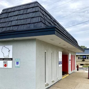 a storefront with a black roof
