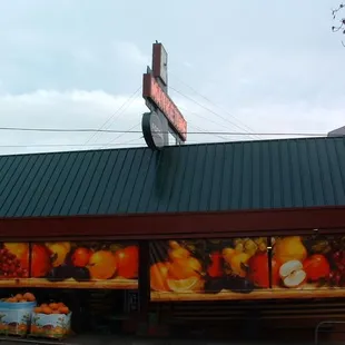 a grocery store with a green roof