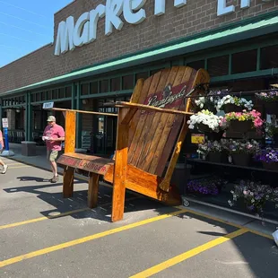 a wooden chair in front of a store