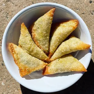 a bowl of fried pastries