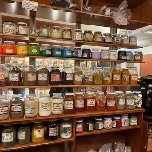 a shelf full of jars and jars