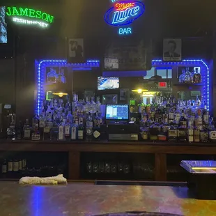 a bar with neon signs