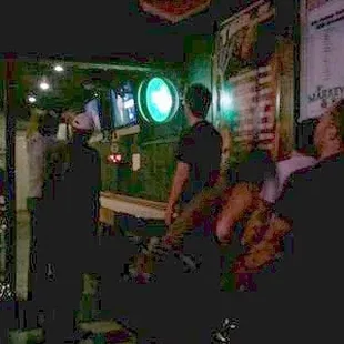 a group of people sitting at a bar