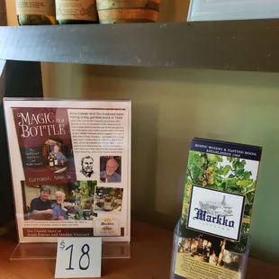 a display of wine bottles and books