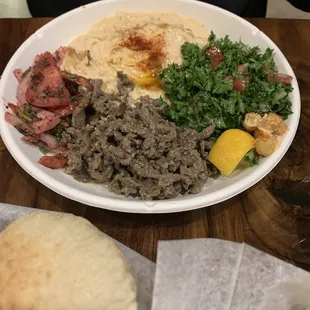 Steak Shawarma platter with Tabulee, spicy hummus and bread!