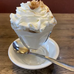 Rice pudding with whipped cream and cinnamon