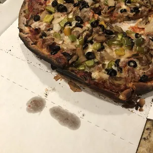a half eaten pizza in a box