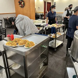 a group of people preparing food